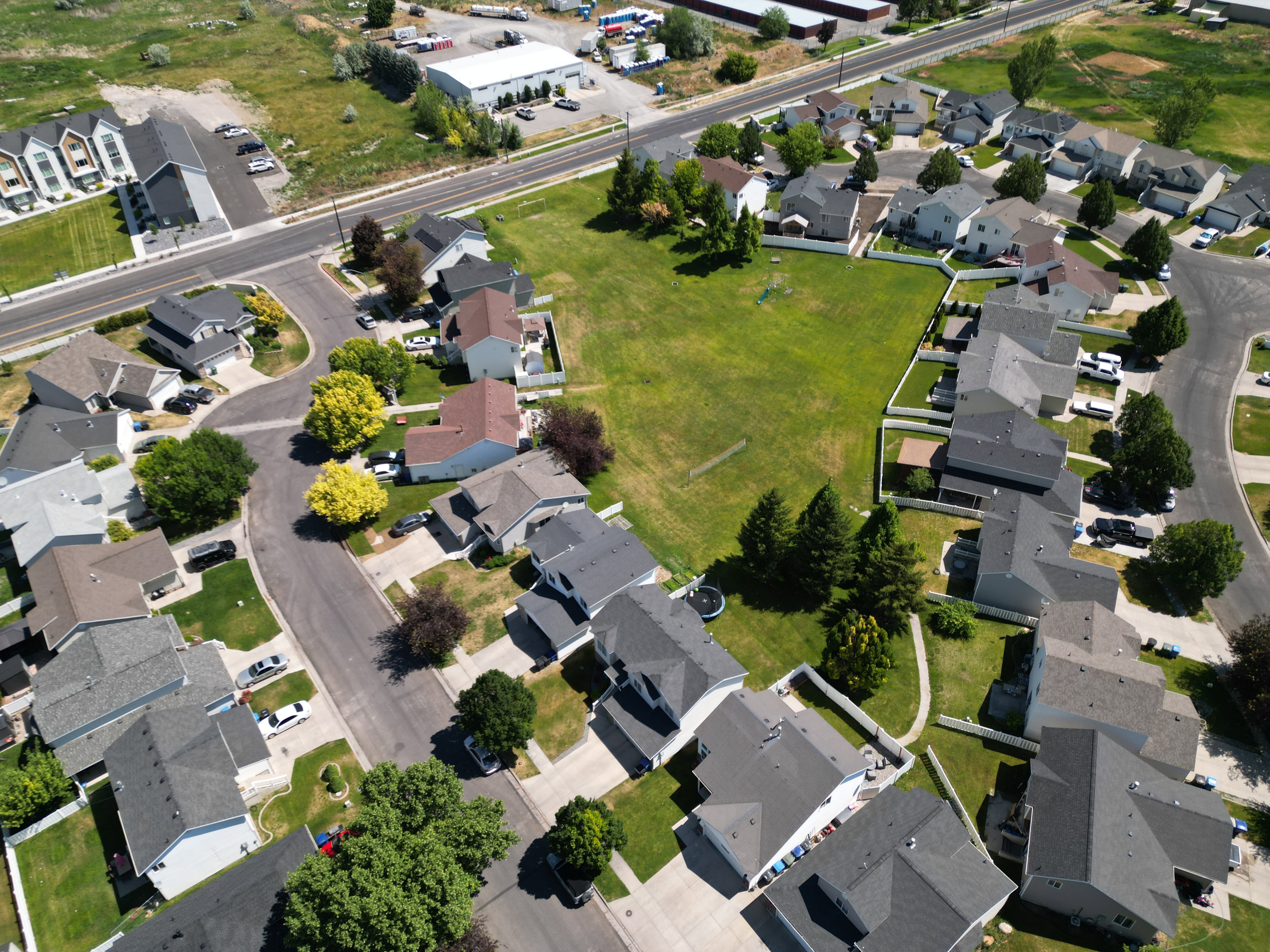 Expansive green space bordered by residential properties