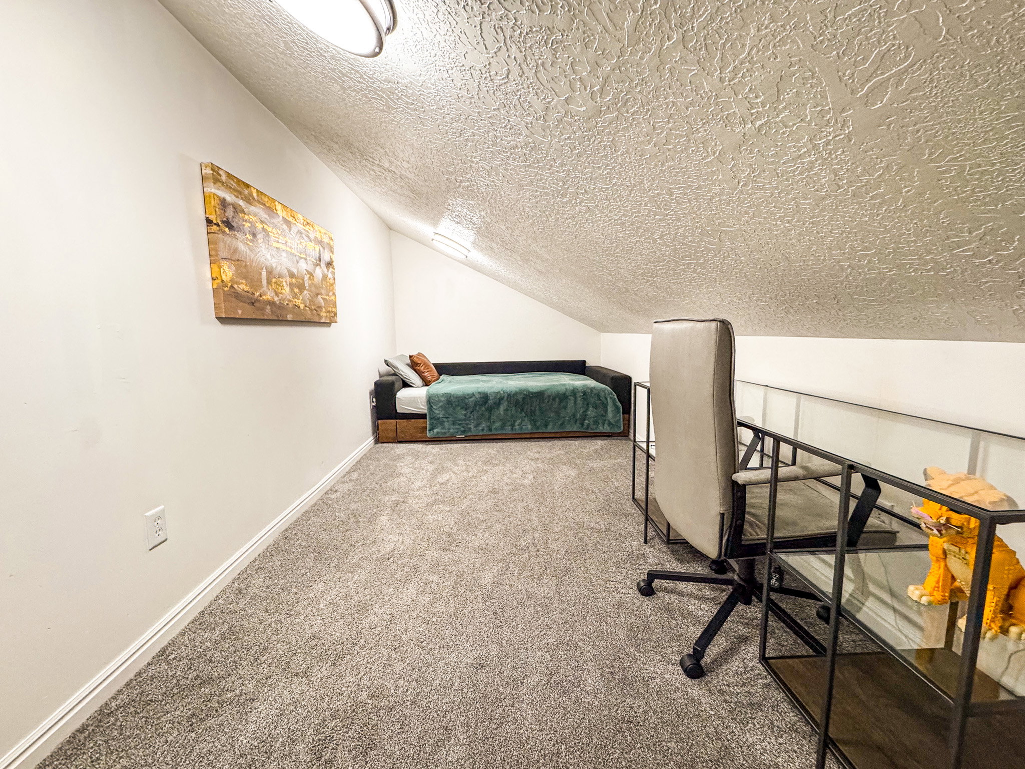 Carpeted bedroom featuring baseboards