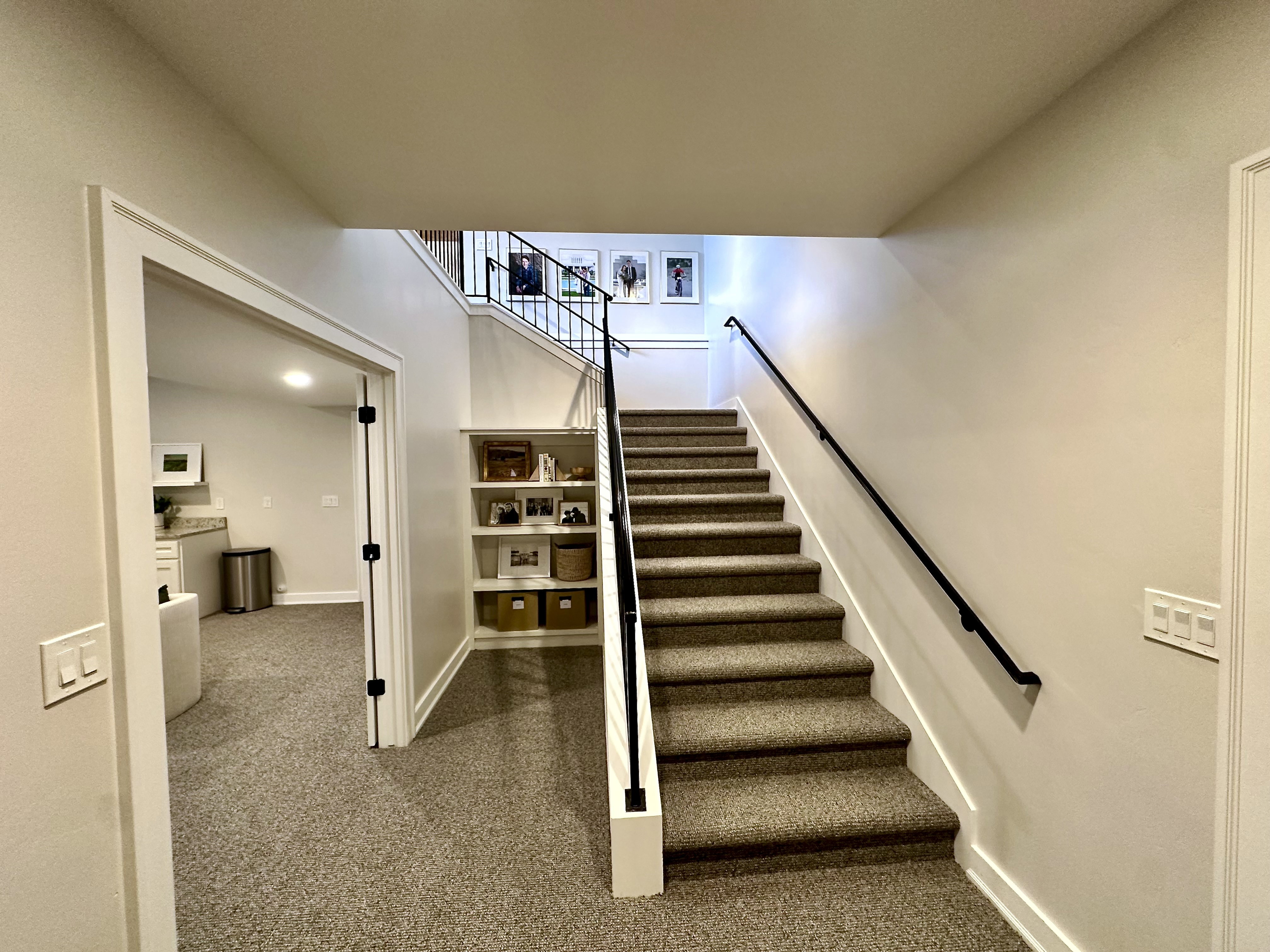 Staircase with carpet flooring and baseboards