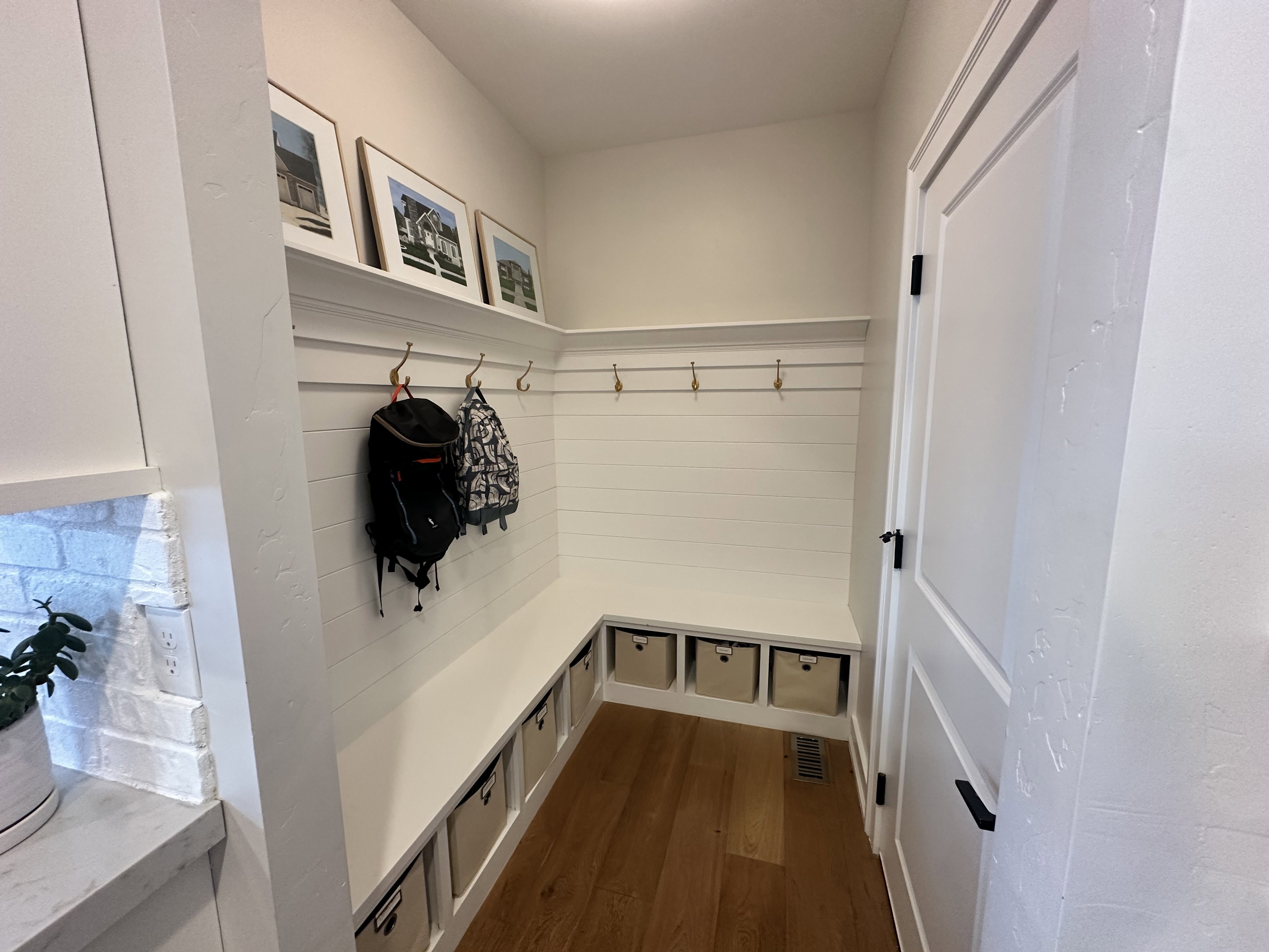 Mudroom featuring dark wood-style flooring
