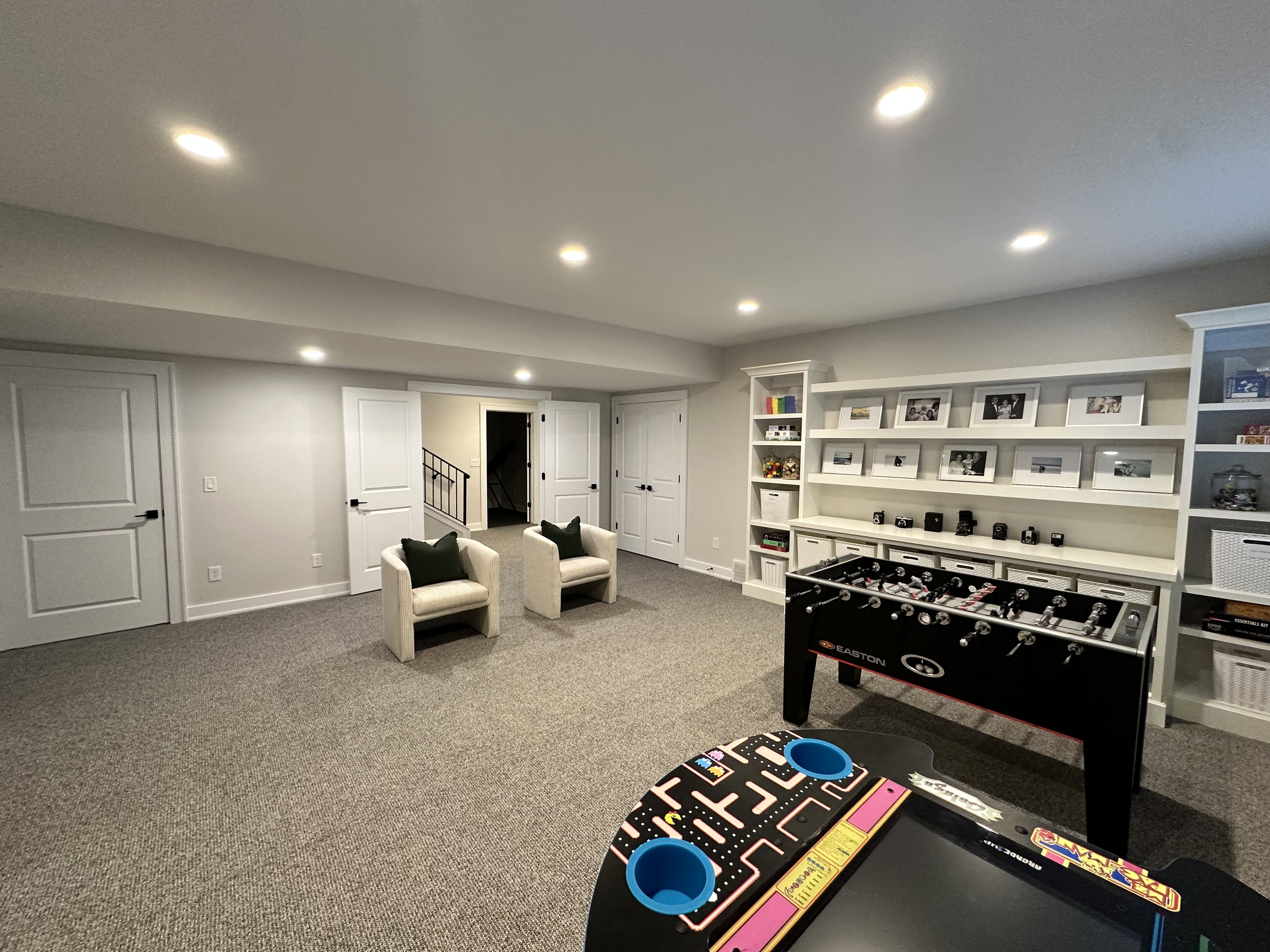 Recreation room featuring light carpet and recessed lighting