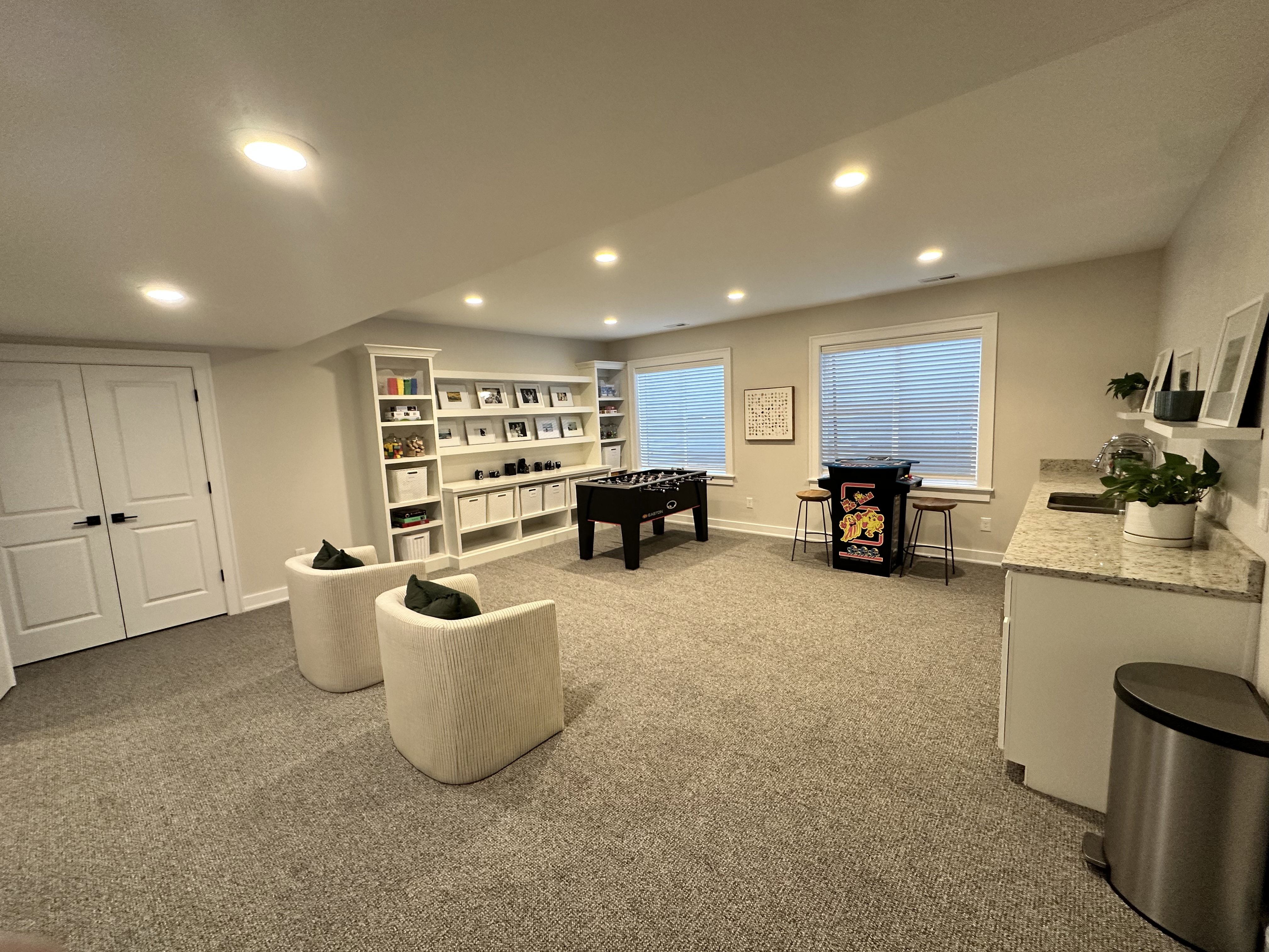 Game room with carpet floors and recessed lighting