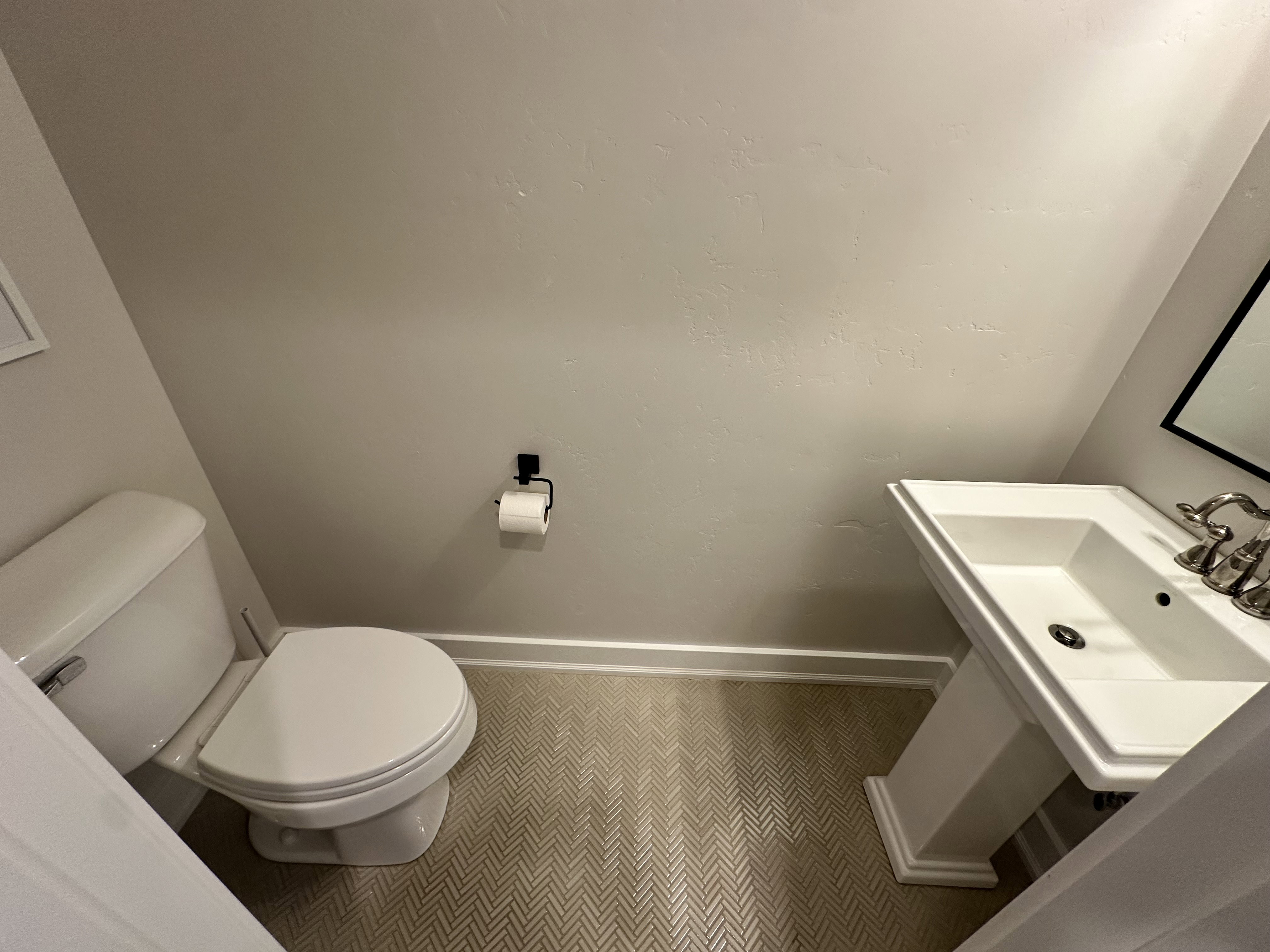 Half Bathroom featuring toilet and tile patterned floors