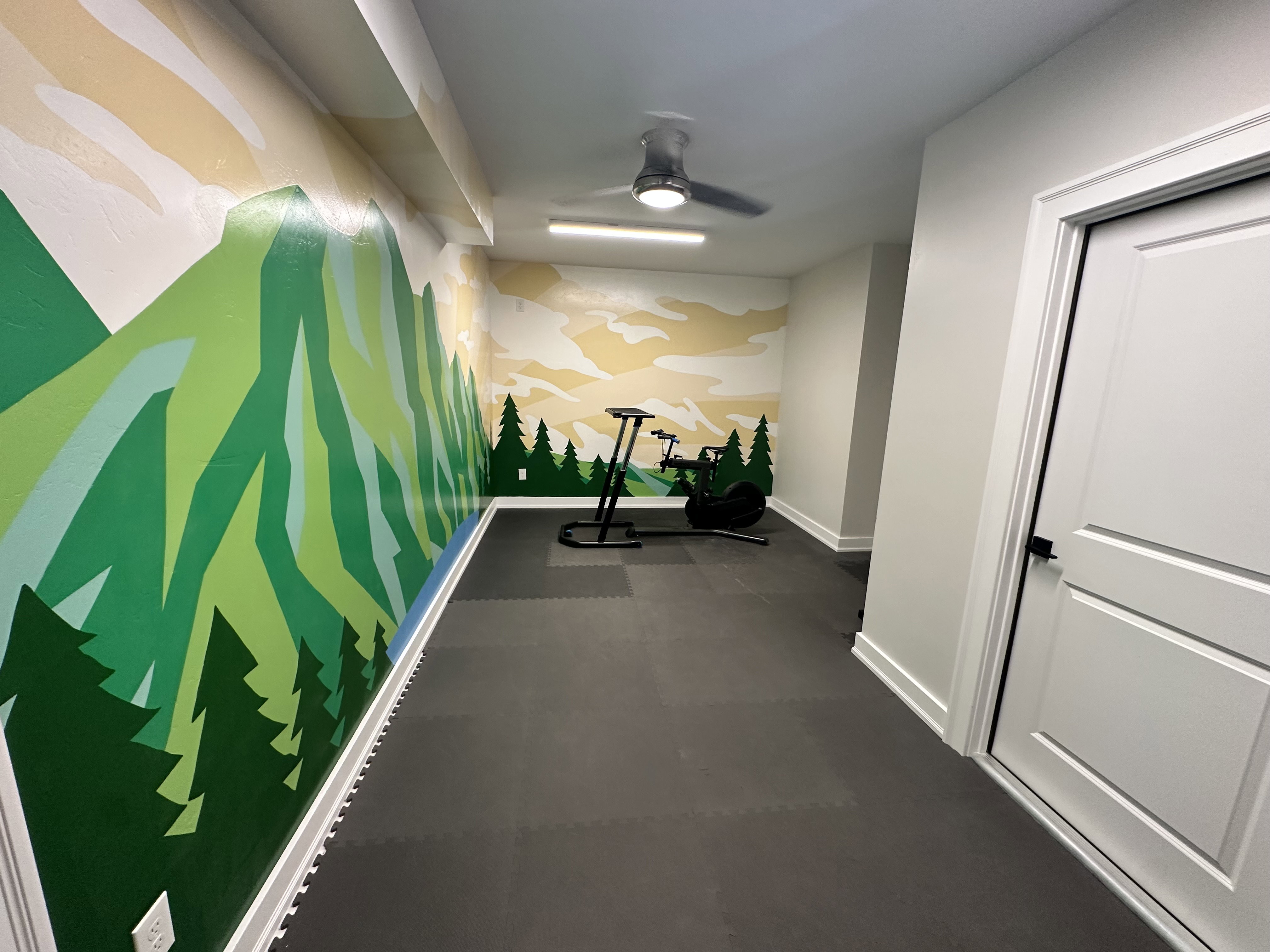 Corridor with baseboards and an accent wall