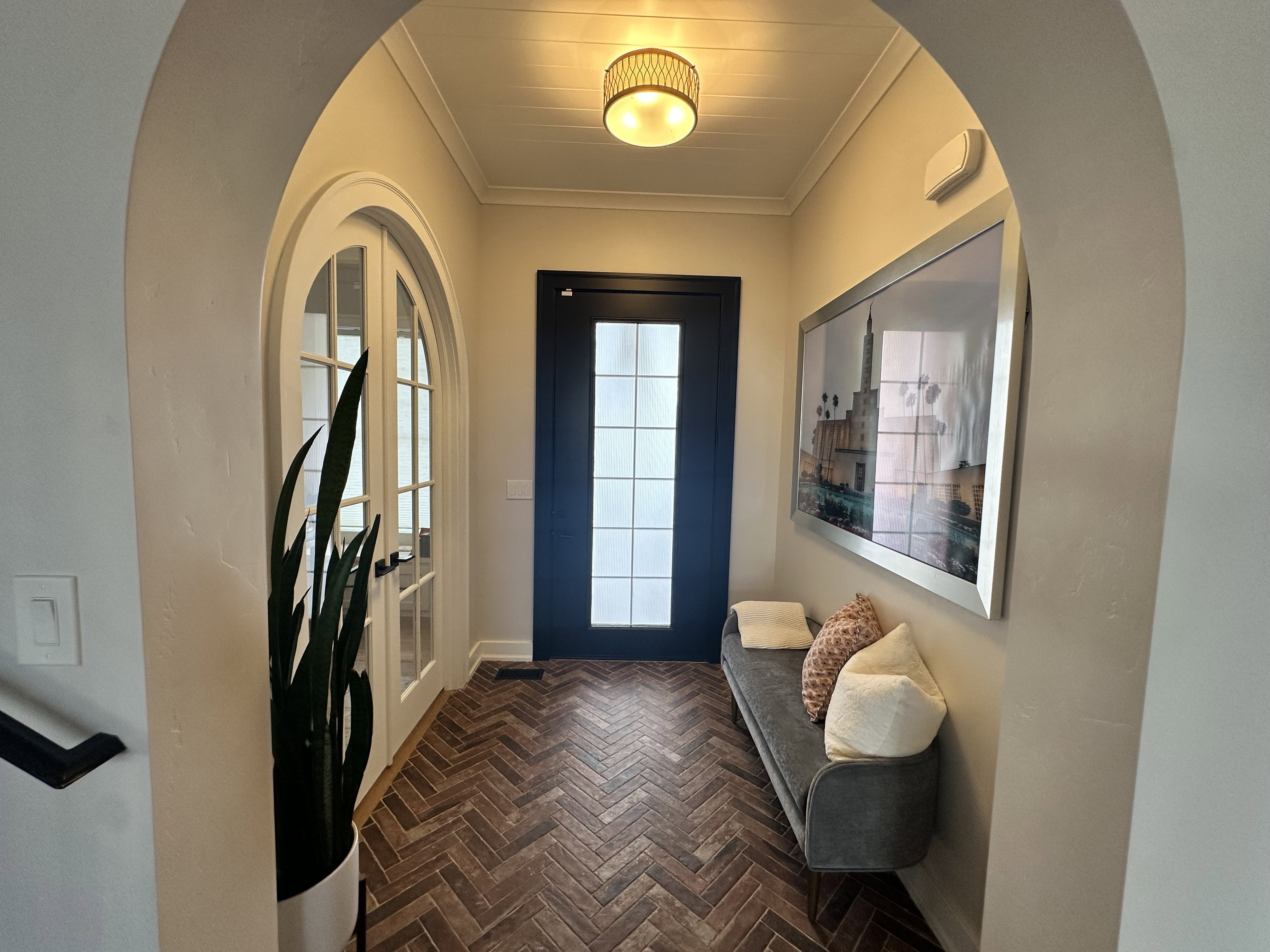 Foyer featuring ornamental molding and french doors