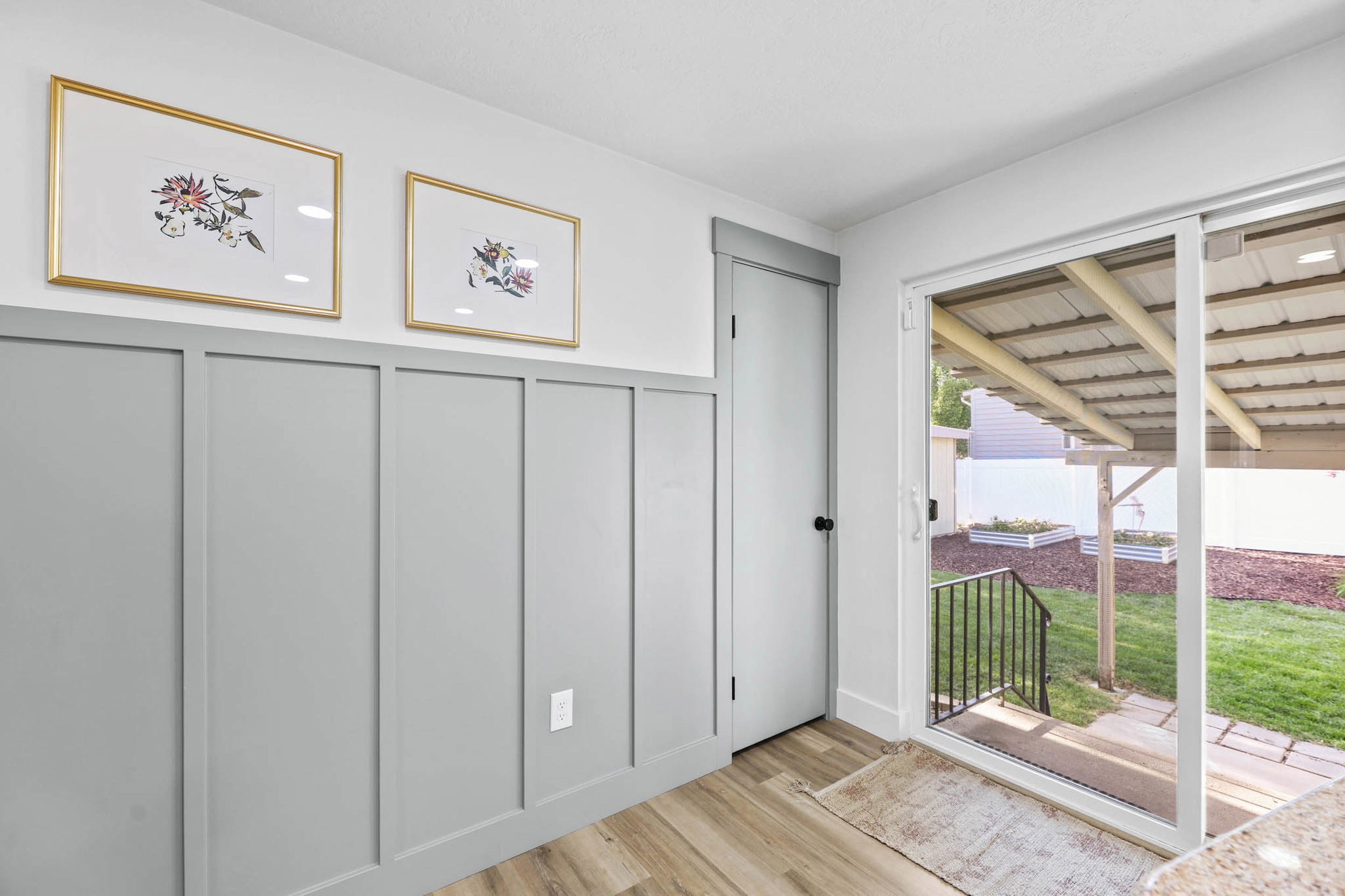 Entryway with a decorative wall and wood finished floors