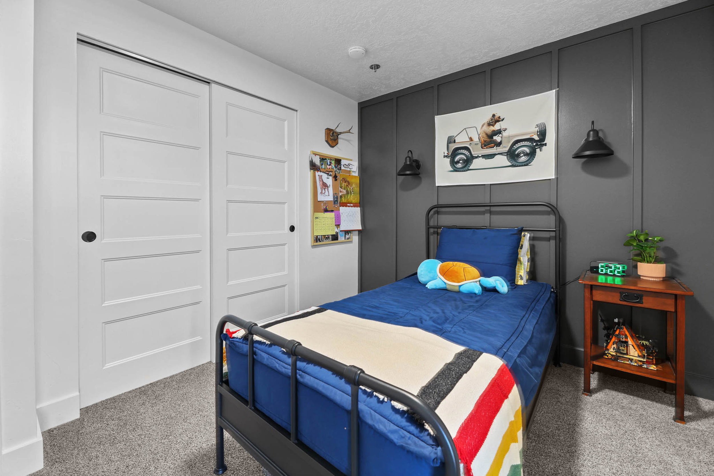 Bedroom featuring carpet flooring, a closet, and a textured ceiling