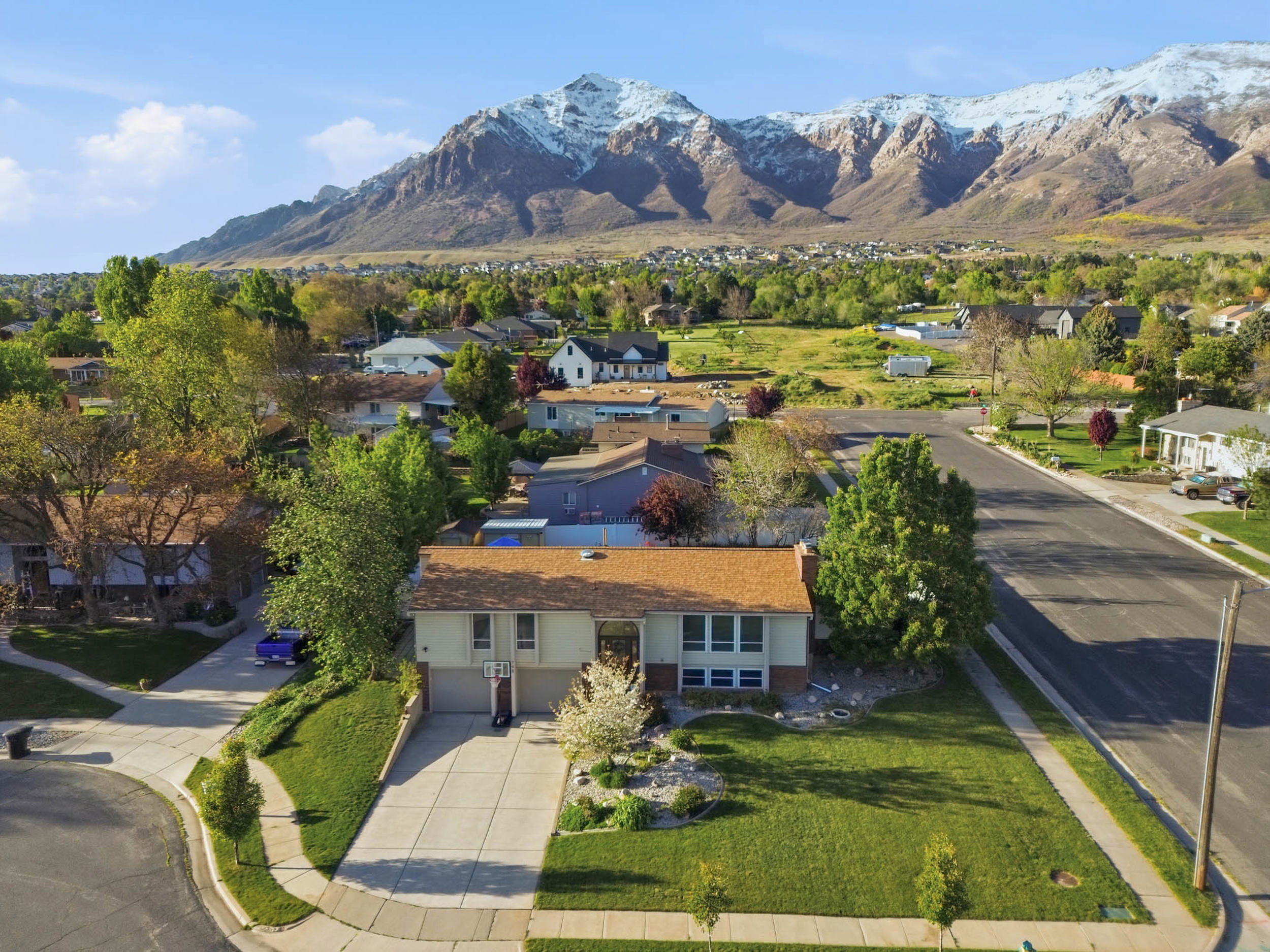 Aerial view of residential area with a mountainous background