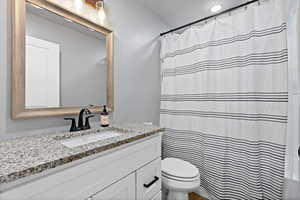 Bathroom featuring vanity and a shower with curtain