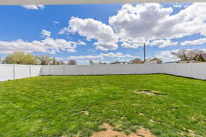 View of fenced backyard