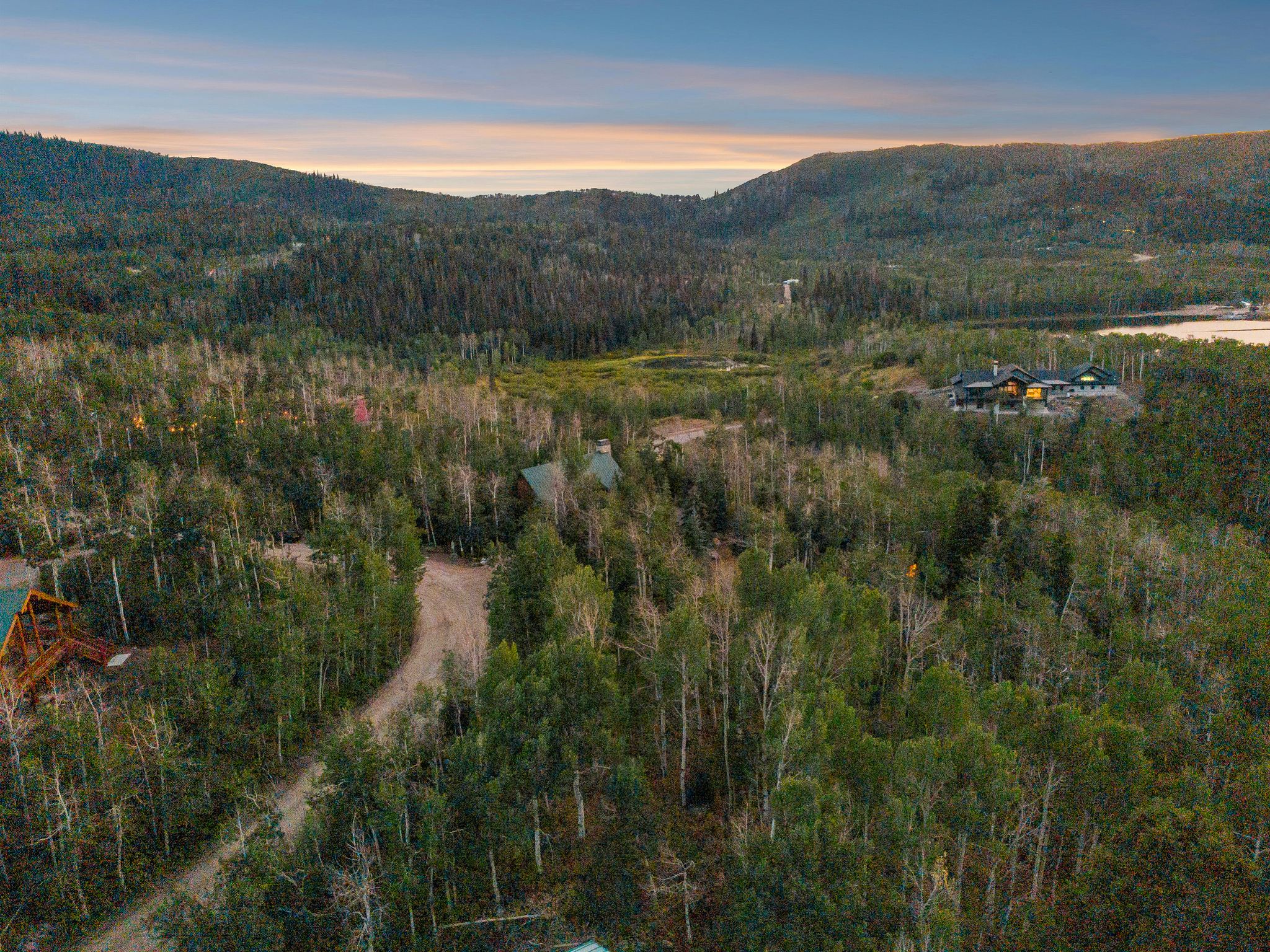 View of mountain backdrop featuring a forest