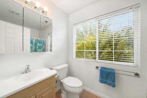 Full bath with a shower with curtain, vanity, and light tile patterned flooring