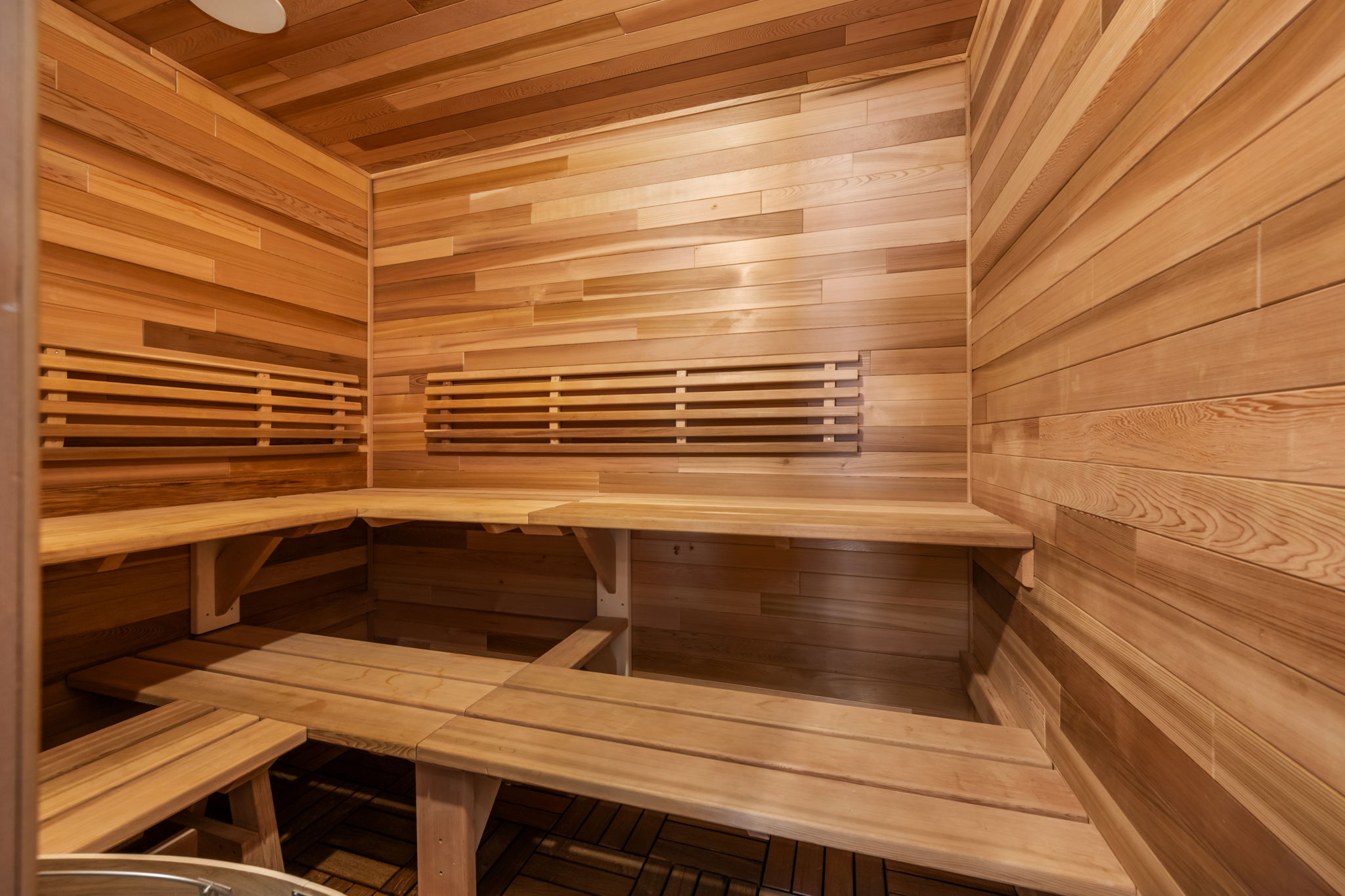 Sauna / steam room with wooden walls and wood ceiling