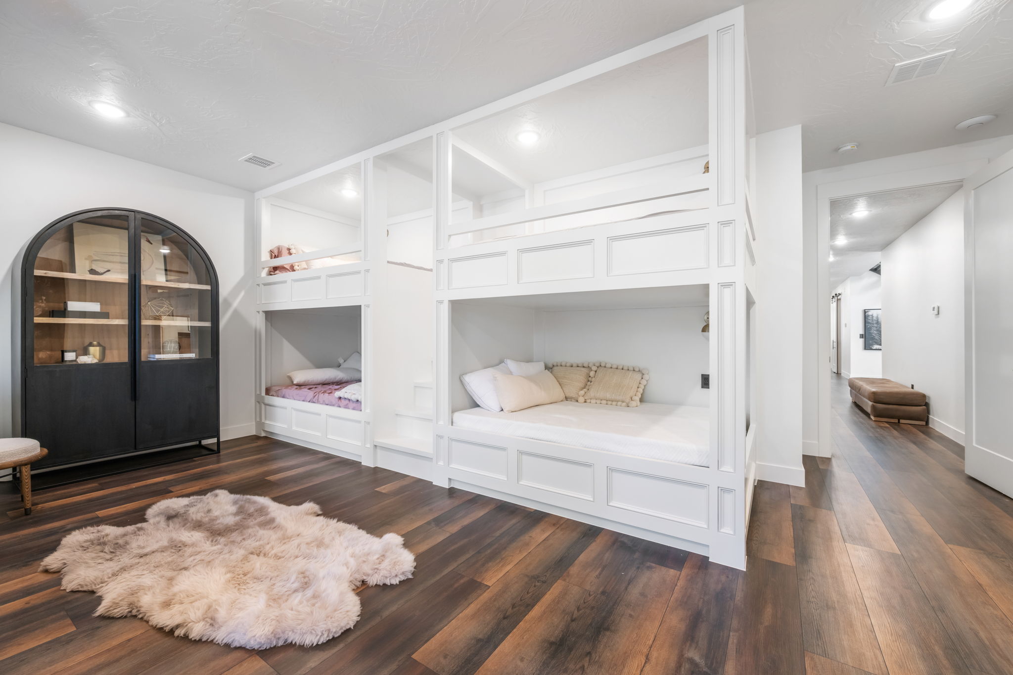 Bedroom featuring dark wood finished floors and baseboards