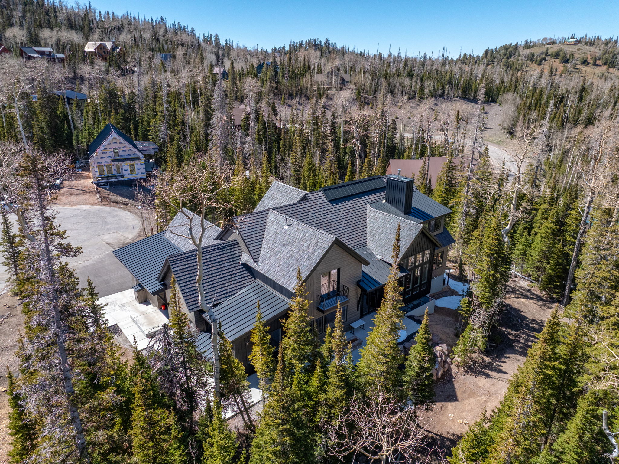 View from above of property with a heavily wooded area