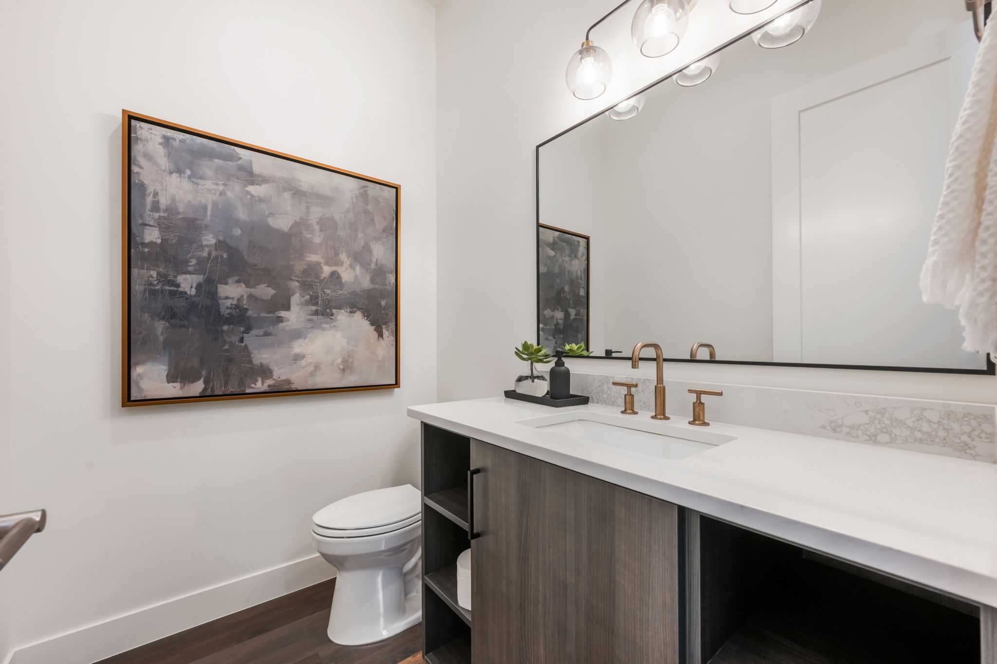 Bathroom with vanity and dark wood-style flooring