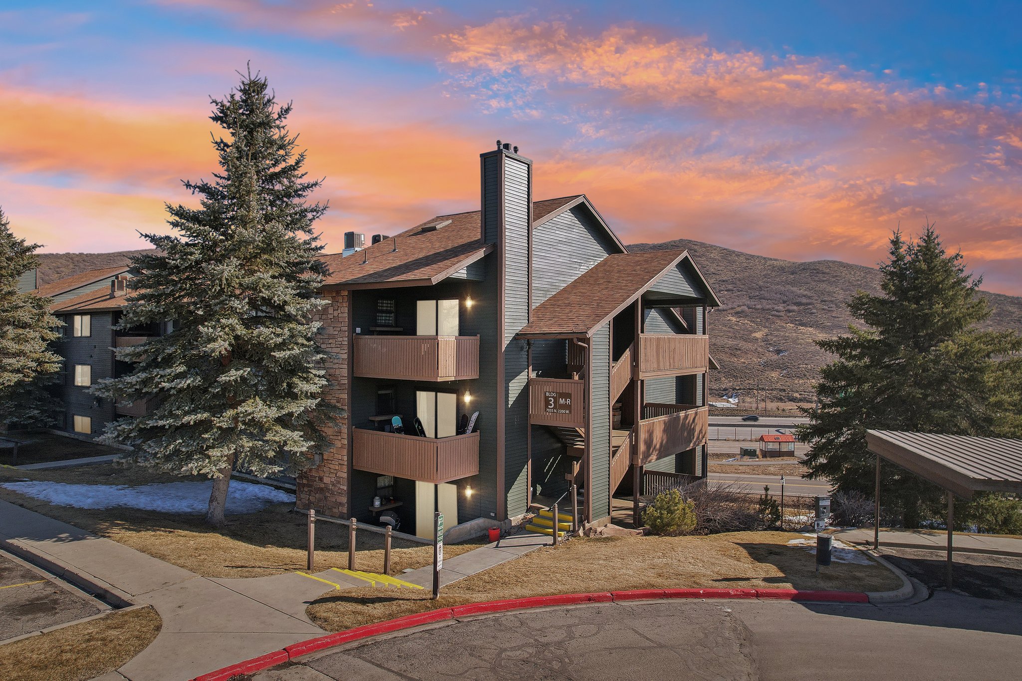 Property at dusk featuring a mountain view