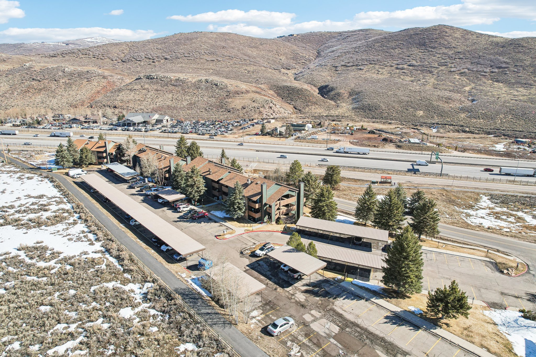 View of property location with mountains and nearby suburban area