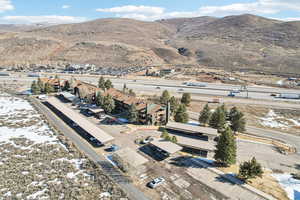 View of property location with mountains and nearby suburban area