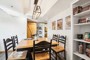 Dining area featuring a barn door