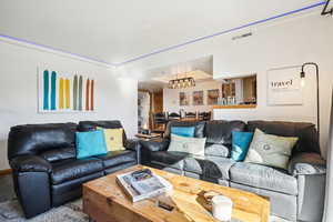Living room featuring a chandelier
