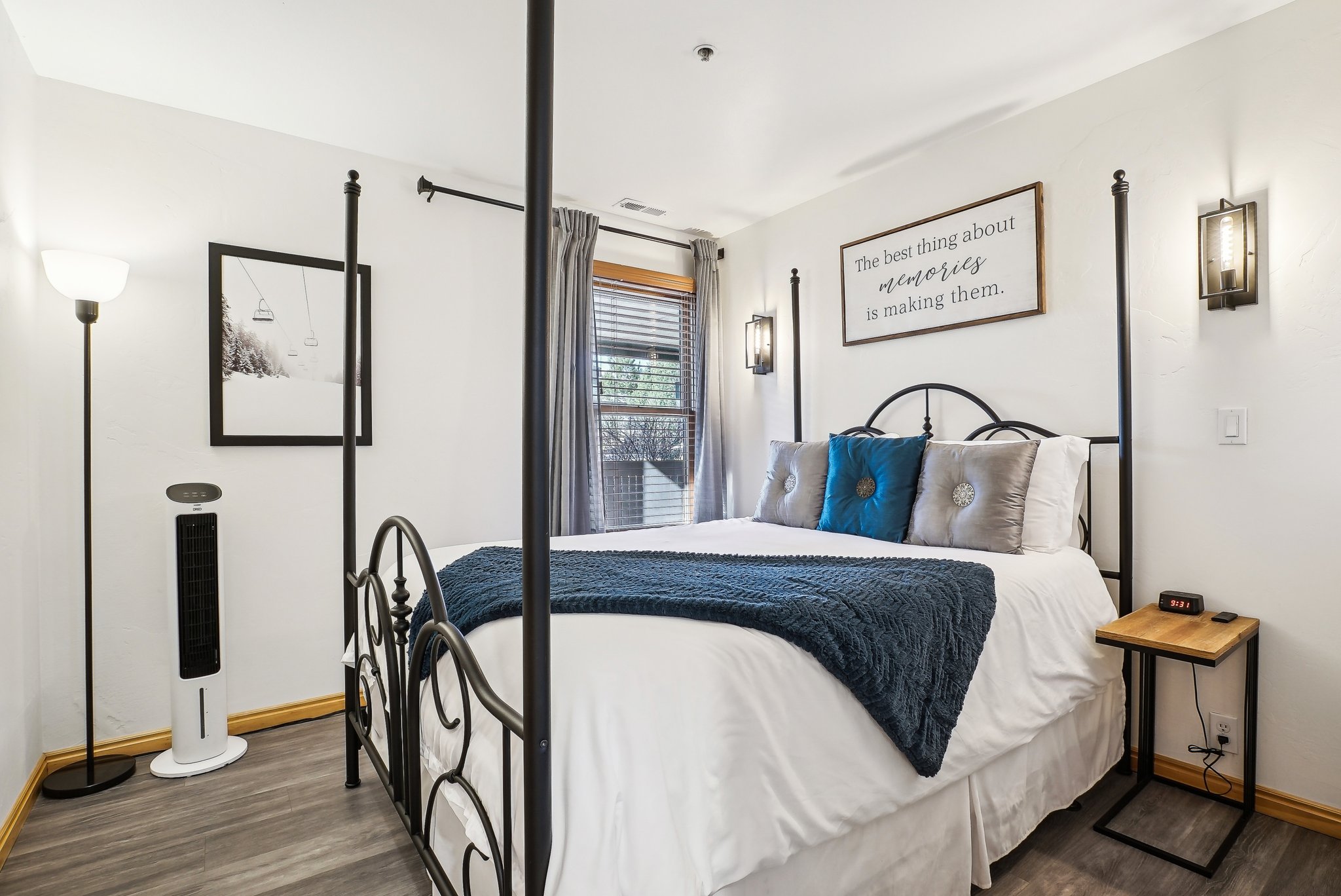 Bedroom with dark wood-style floors and baseboards