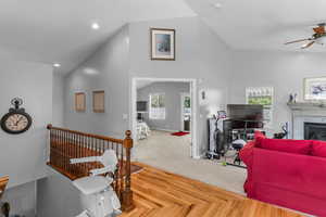 Open concept living area with plenty of natural light, and lofted ceiling