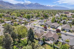 Aerial view of the neighborhood with a mountainous background