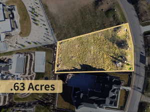 Aerial view of property and surrounding area featuring property boundaries highlighted