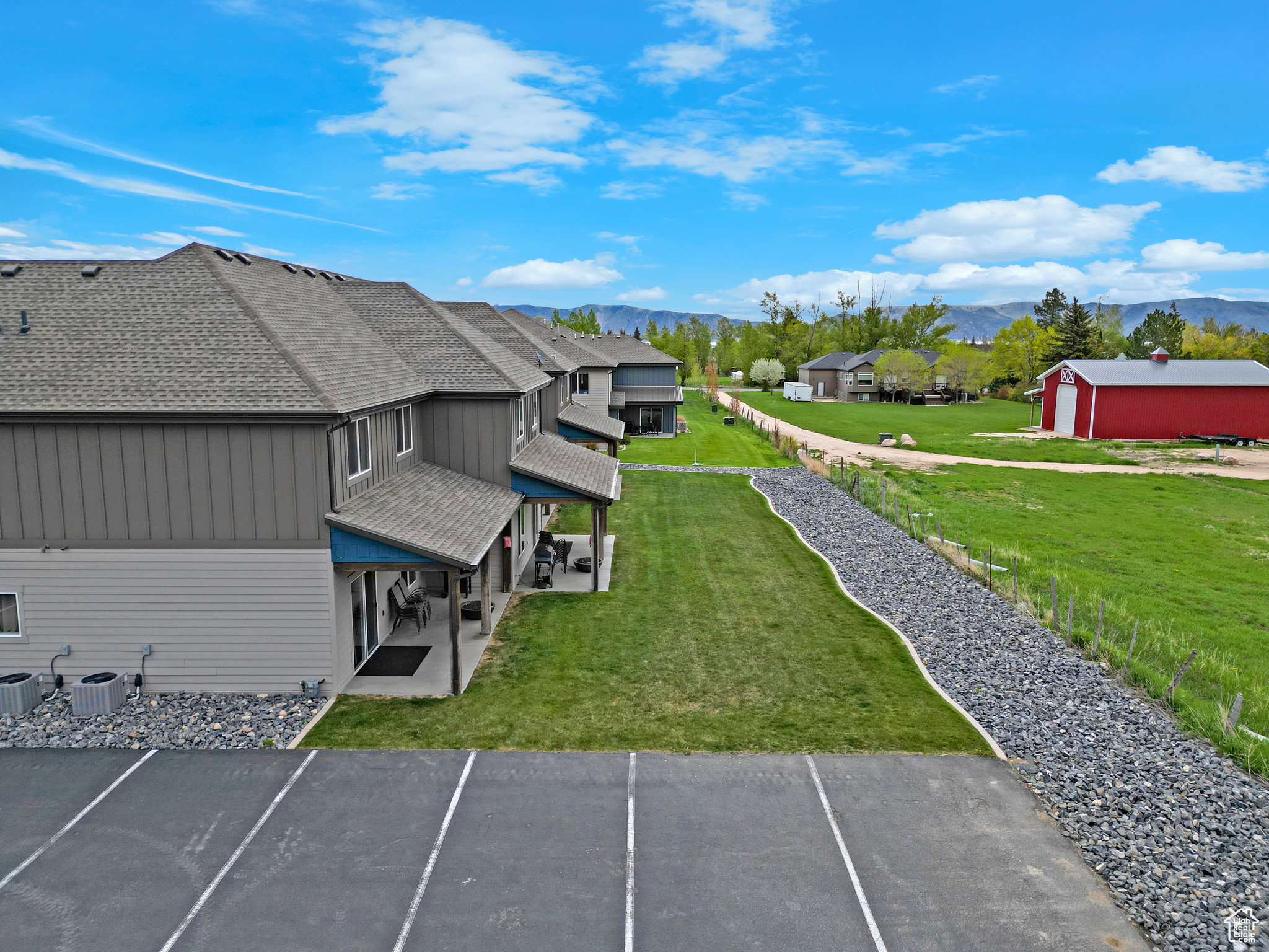 Aerial perspective of suburban area with a mountain backdrop