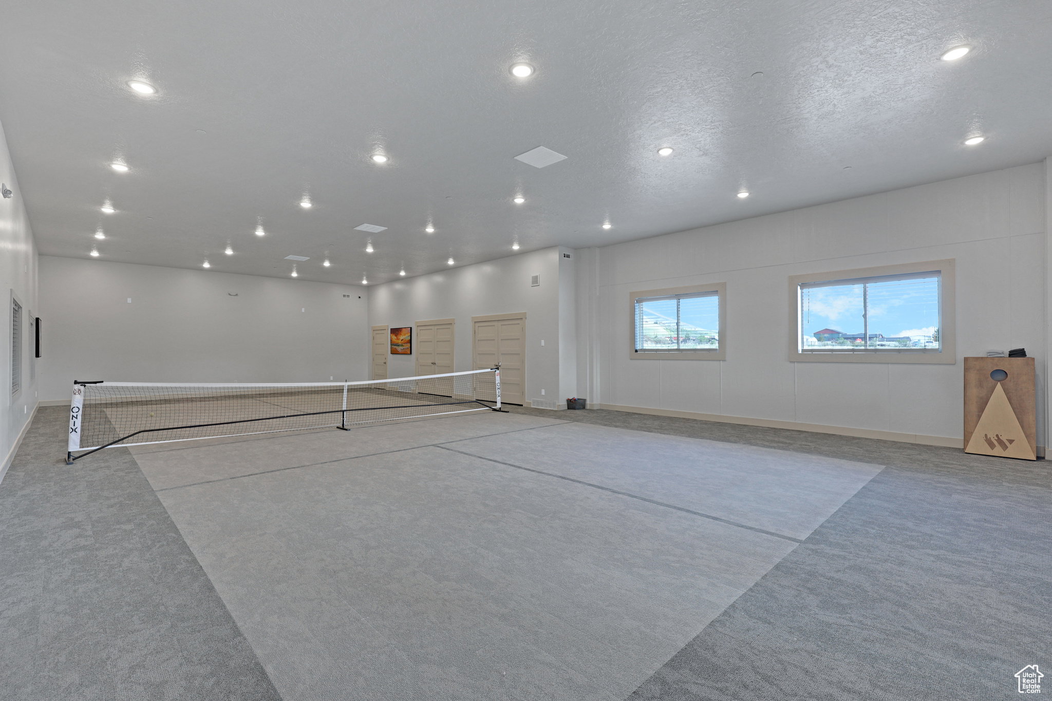 Miscellaneous room with recessed lighting and a textured ceiling