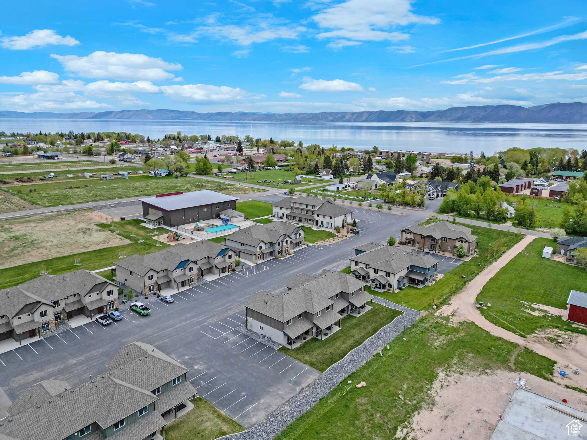 Aerial perspective of suburban area featuring a water and mountain view