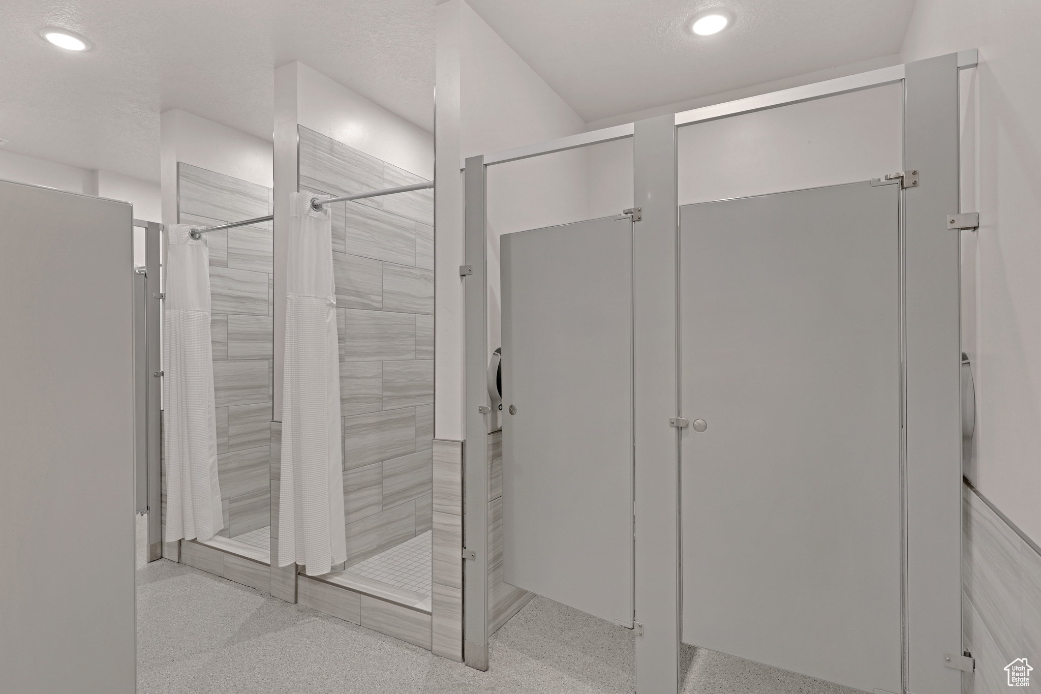 Full bathroom featuring a stall shower and recessed lighting
