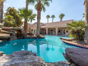 Community pool with a patio area