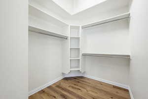 Walk in closet featuring light wood finished floors
