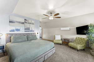 Bedroom with lofted ceiling, carpet floors, and ceiling fan