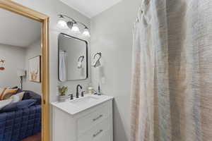 Bathroom with vanity, a shower with curtain, and ensuite bathroom