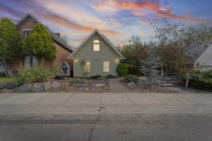 View of front of house with brick siding
