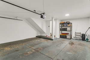 Garage featuring a garage door opener