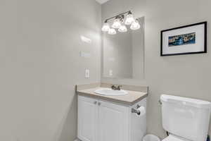 Bathroom with vanity and toilet