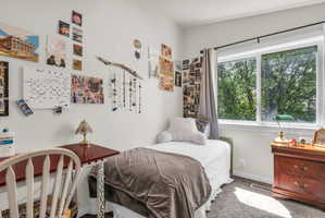 Carpeted bedroom with baseboards