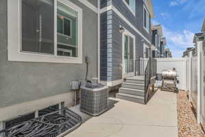 Fenced backyard featuring area for grilling and a patio area