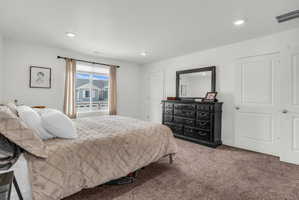 Carpeted bedroom featuring recessed lighting