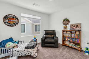 Carpeted bedroom with baseboards