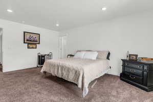 Bedroom featuring carpet and recessed lighting