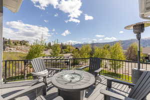 Wooden deck featuring a mountain view