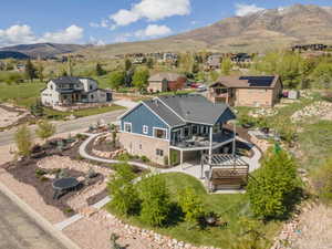 Aerial perspective of suburban area featuring a mountain backdrop