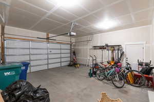 Garage featuring a garage door opener