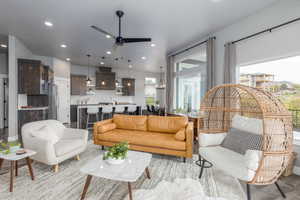 Living room with ceiling fan and recessed lighting