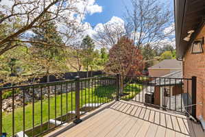 Deck featuring a lawn